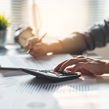 Tax deduction planning concept. Businessman calculating business